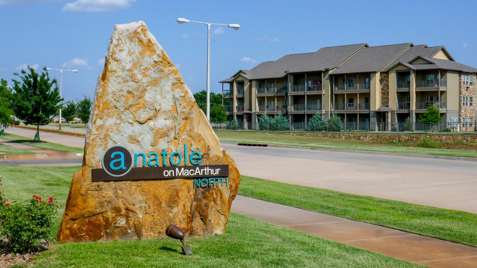 a large rock with the word selena on it at The Anatole on MacArthur North