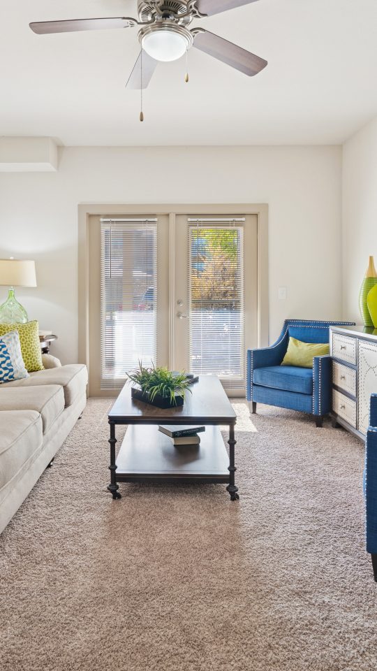 a living room filled with furniture and a couch