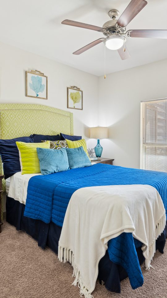 a bedroom with a bed and a dresser