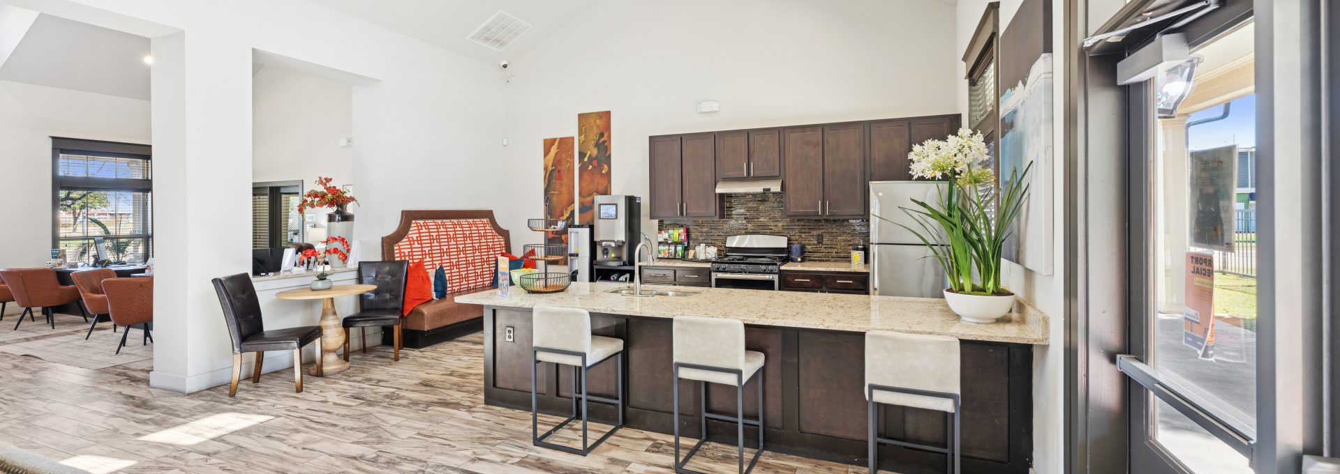 a kitchen filled with furniture and appliances