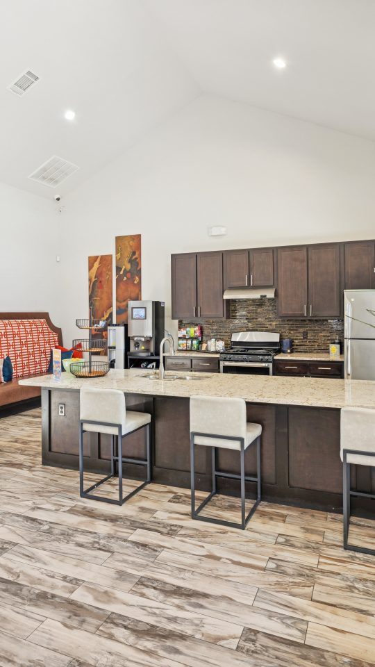 a kitchen filled with furniture and appliances
